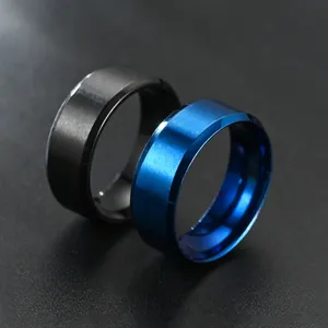 Close-up of matte brushed titanium steel rings with slanted edges in black and blue.