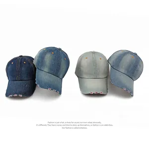 Distressed washed denim baseball cap with frayed brim and contrast stitching style