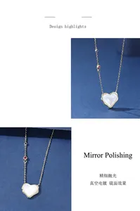 Macro view of the heart-shaped mother-of-pearl pendant and polished silver chain.