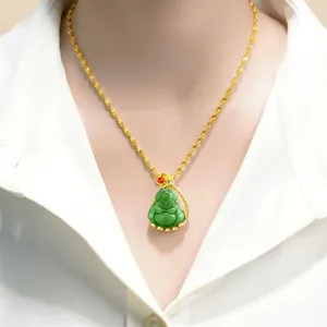 Detailed view of a green jade Buddha pendant necklace worn on a model with a gold chain
