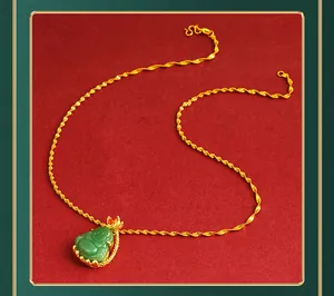 Close-up detail showing the intricate green Buddha pendant and golden water wave chain.