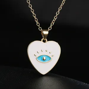 Elegant 18K gold plated heart necklace featuring a blue evil eye enamel pendant