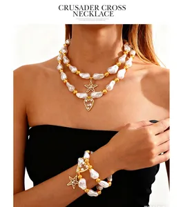 Model wearing baroque pearl necklace and bracelet set with star and heart charms