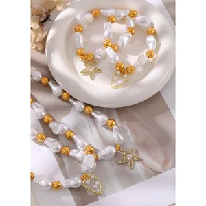Elegant irregular faux pearl necklace and bracelet set with gold star and heart charms