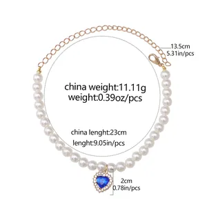 Detail view of pet pearl necklace with blue heart pendant and size measurements.