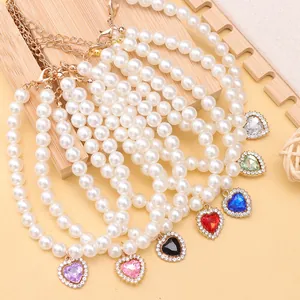 Elegant heart-shaped pearl pet necklace for cats and dogs available in assorted colors.