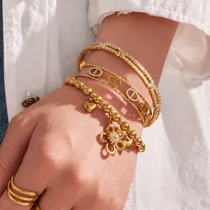 Elegant 18K gold plated stainless steel bracelet set with zircon flower and charms