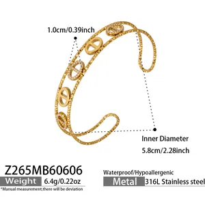 Detail of gold stainless steel pig nose cuff bracelet with cubic zirconia and dimensions
