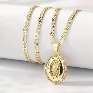 Gold Virgin of Guadalupe pendant necklace with crystal accents on Figaro chain for women
