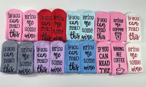 Variety of colorful coral fleece socks featuring humorous 'If you can read this' text prints