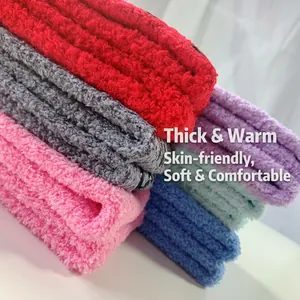 Close-up detail of soft coral fleece sleep socks showing thick and fuzzy texture in multiple colors