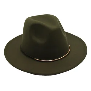 Macro shot of a dark green wool felt fedora hat featuring a stylish gold metal bar accent