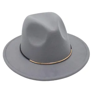 Detail of a classic grey wool felt fedora hat featuring a stylish gold and black band.