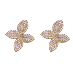 Exquisite four-petal flower stud earrings with full pavé clear diamonds in a gold finish