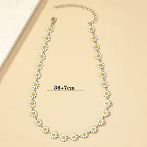 Minimalist elegant white daisy flower necklace with adjustable silver extension chain.