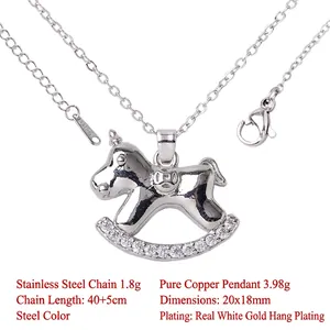 Close-up detail of silver-plated rocking horse unicorn pendant necklace with gems