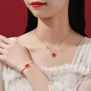 Elegant red ox zodiac necklace and bracelet set for women, perfect for lunar year gift.
