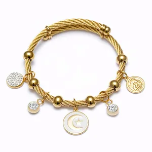Élégant bracelet câble en acier inoxydable plaqué or 18 carats avec breloques lune et cristal