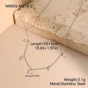 Detail view of a stainless steel necklace featuring small marquise white stone charms.