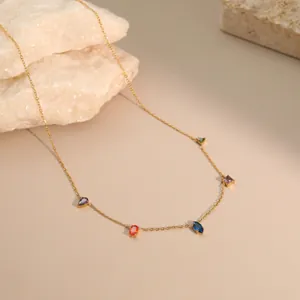Detailed view of a gold-plated stainless steel necklace featuring various colorful gemstones.