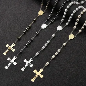 Four-piece set of trendy stainless steel rosary bead necklaces featuring cross pendants