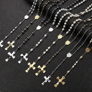 Multiple stainless steel rosary bead necklaces with cross pendants in gold and silver finishes