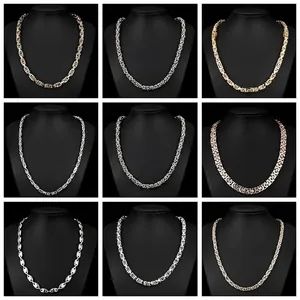 Showcase of various stainless steel necklace styles on black mannequin displays for jewelry detail