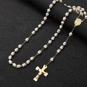 Elegant stainless steel rosary necklace with white beads and gold crucifix pendant detail