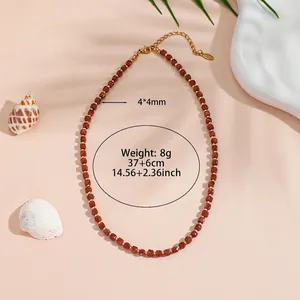 Detail of gold sandstone bead necklace showing dimensions and weight specifications.