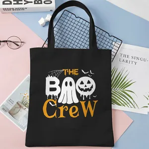 Black Halloween Boo Crew canvas tote bag with ghost and pumpkin graphic print decoration