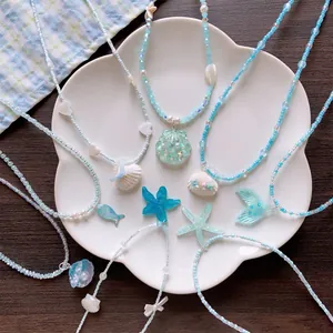 Handmade summer beach beaded necklaces featuring shell and starfish pendants in blue