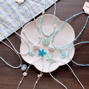 Summer island themed beaded necklace with sea shell and starfish pendants for vacation