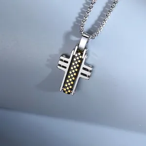 Detailed close-up of a silver cross pendant necklace with a black and gold checkerboard design