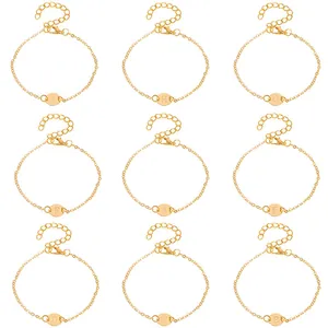 Multiple gold chain bracelets featuring engraved round alphabet charms in a 3x3 grid layout