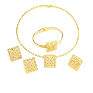 Detailed view of an elegant gold stainless steel jewelry set with woven square motifs