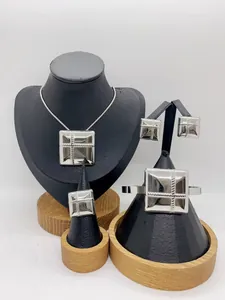 Complete stainless steel jewelry set featuring square textured necklace and bracelet