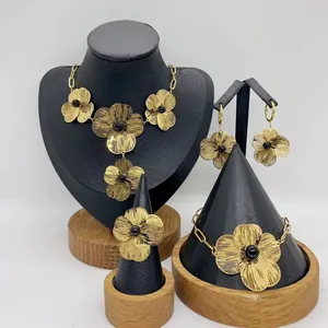 Elegant gold stainless steel flower jewelry set with necklace earrings ring bracelet.