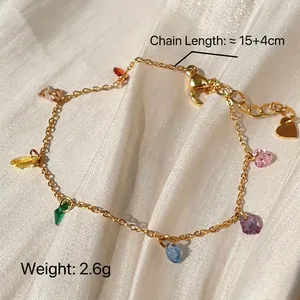 Detailed view of gold titanium steel bracelet with colorful zircon charms and heart tag