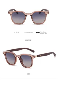 Detail view of wood grain temple sunglasses with tea frame and gradient lenses