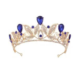 Exquisite gold Baroque bridal tiara featuring teardrop blue rhinestones and crystals