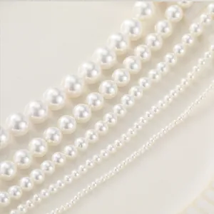 Various sizes of glossy white round shell pearls for handmade DIY jewelry making