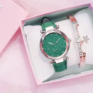 Close-up view of a green glitter dial watch with frosted leather strap and matching bracelet