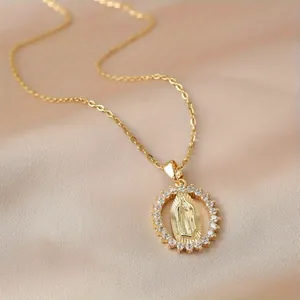 Close-up of 18k gold plated Virgin Mary relief pendant necklace with crystal halo.