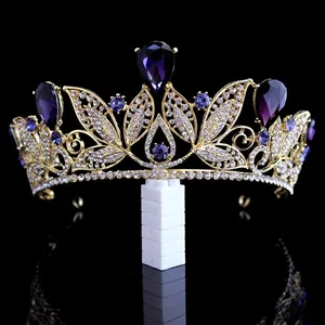 Close-up detail of vintage gold bridal tiara with elegant purple water drop crystals