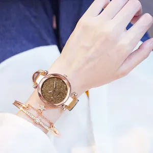 Lifestyle detail shot of the rose gold starry dial watch with star charm bracelet set