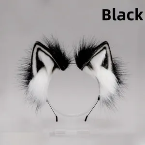 Close-up detail of handmade black and white plush fox ears on a thin headband