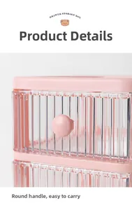 Close-up detail of a pink desktop storage drawer featuring a round handle and transparent ribbed panel.