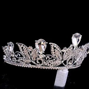 Detailed side view of silver Baroque bridal crown with sparkling teardrop rhinestones for wedding