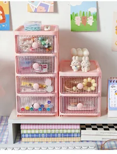 Cute pink desktop multi-layer drawer organizer shown in a cozy home office setup