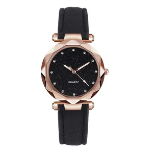 Detail of women's starry sky watch with rhinestone dial and frosted black leather strap